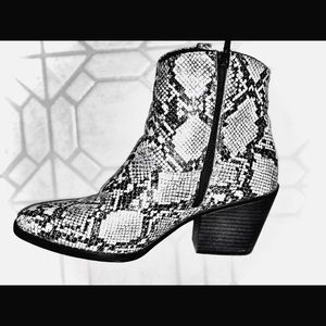 Rattlesnake boots, ankle length, cowboy style.
